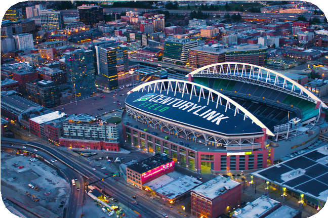 A stadium and cityscape at nightAI-generated content may be incorrect.
